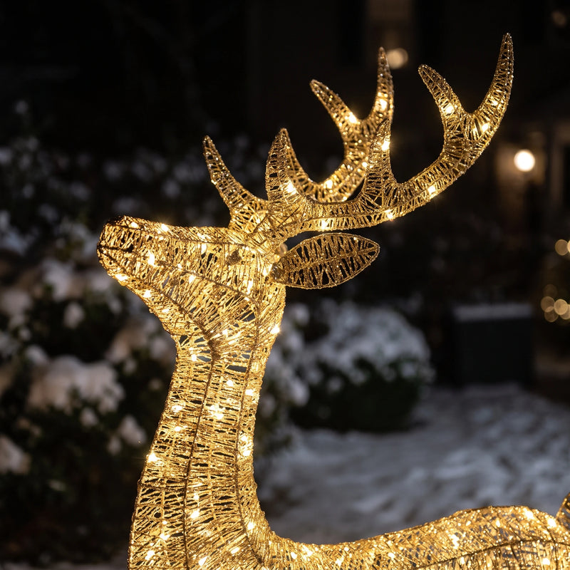 Close-up of the glittering gold wire and micro lights on the deer's antlers