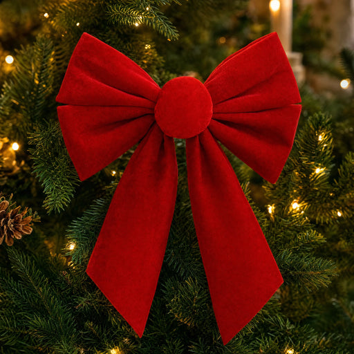 Close-up of the round knot and velvet loops of a red Christmas bow