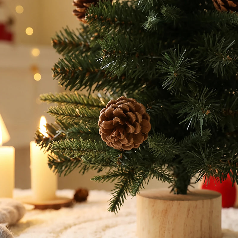 Close-up of a pine cone among the mixed pine needles and the wooden base