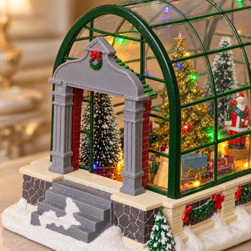 Close detail of the gray entrance portico and green greenhouse frame