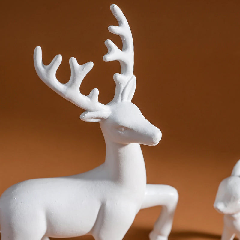 Close view of white antlered deer figurine
