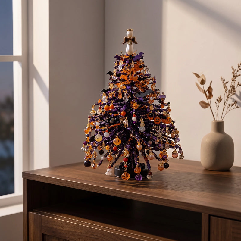 Dark beaded seasonal tree with orange pumpkin-shaped decorations