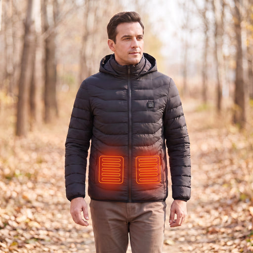 Black hooded heated jacket worn outdoors with schematic red-orange lower-front heating zones based on the supplier illustration; not a thermal measurement