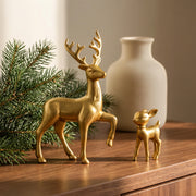 White deer and fawn figurines displayed together on a home shelf