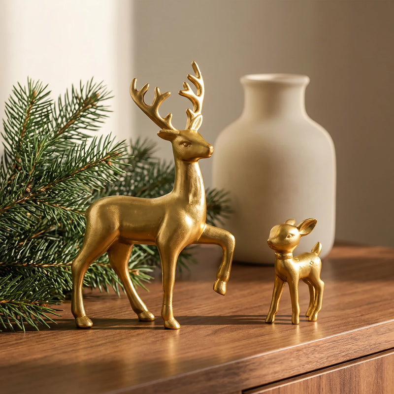 White deer and fawn figurines displayed together on a home shelf
