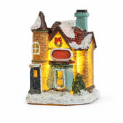 Style J snow-covered resin Christmas village house on a white background