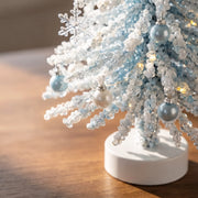 Close view of the white and pale blue beaded winter tree