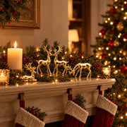 Golden reindeer figurines on a Christmas mantel