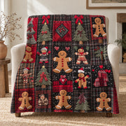 Tartan gingerbread Christmas throw blanket in dark plaid, draped over a linen armchair