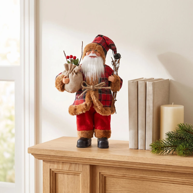 Plaid Santa figurine on a light oak mantel next to books and a candle