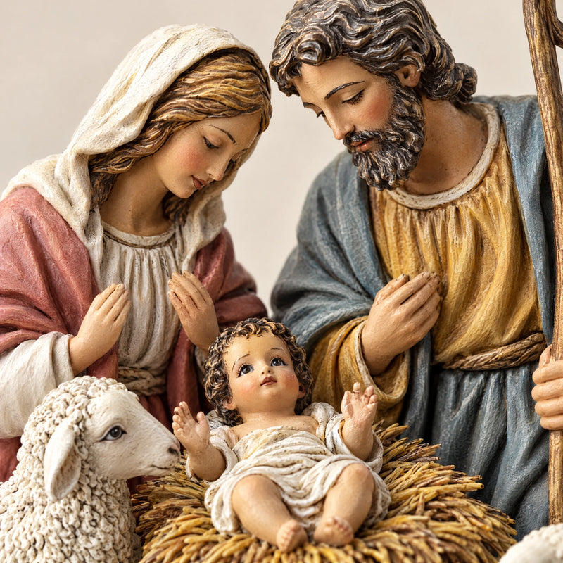 Close-up of the faces and the woollen sheep of the nativity scene figurine