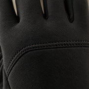 Macro close-up of the matte softshell and the seam across the back of the black glove