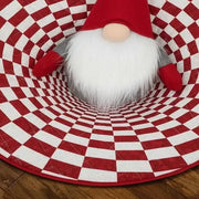 Close view of the printed checkerboard pattern and gnome on a flat round rug