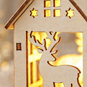 Close detail of the reindeer cutout and thin wooden panel edges of the Christmas house ornament