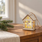 S9 reindeer lighted Christmas house ornament displayed on a wooden console in a Christmas interior