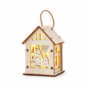 S7 — Tree Cutout lighted wooden Christmas house ornament on a white background