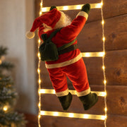 Detail of the textile Santa figure, dark belt and green mittens beside a lighted rung