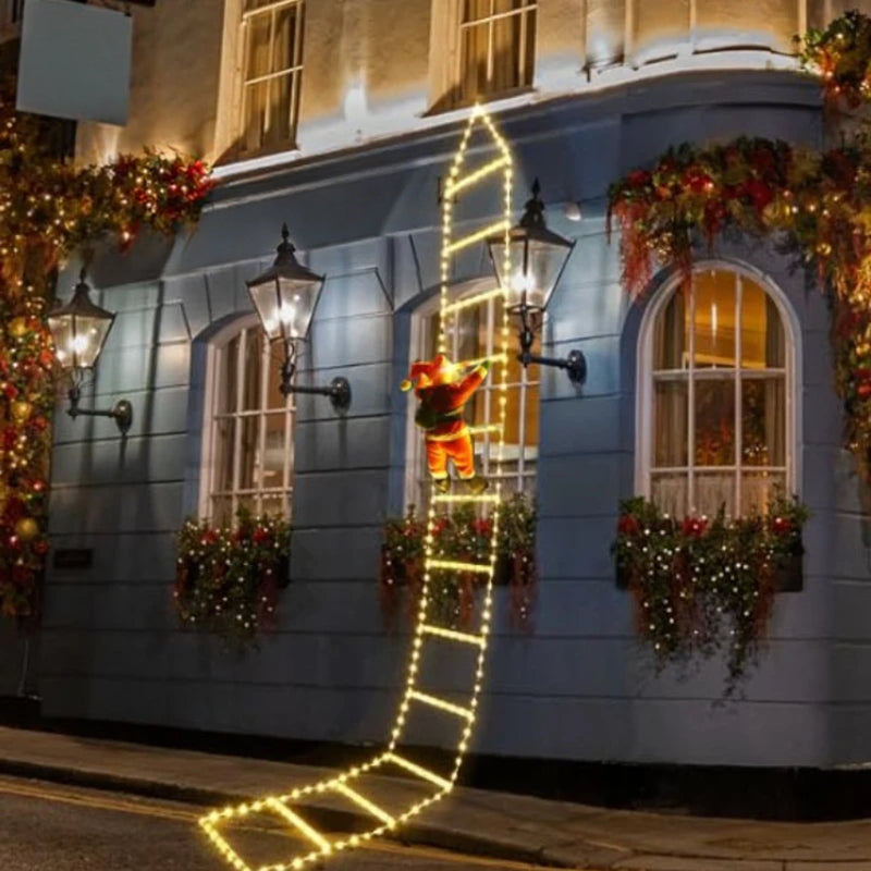 Three-meter Warm White Santa Climbing Ladder Light against a decorated facade at night