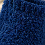 Macro close-up of the brushed fleece pile of the navy socks