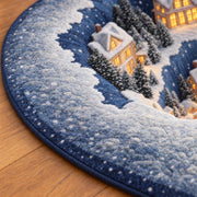 Close detail of the rug's blue snowy print, short-pile textile surface and finished edge